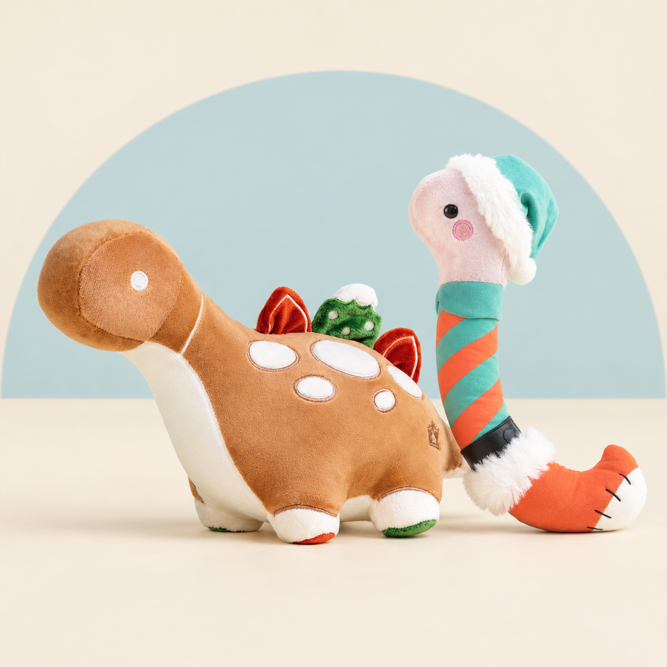 Gingerbread Bronti and Wormi with Elf Outfit on a cream background with a soft blue curve